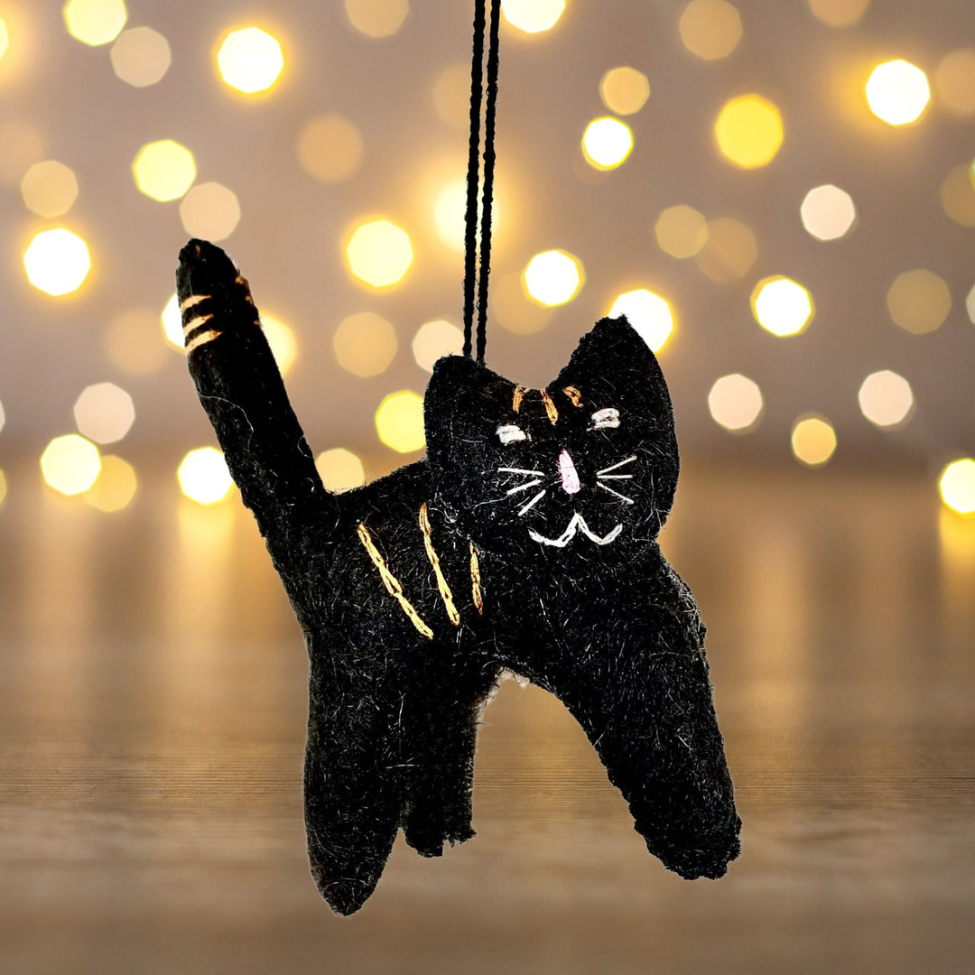 Black Cat Felted Ornament Christmas lights background