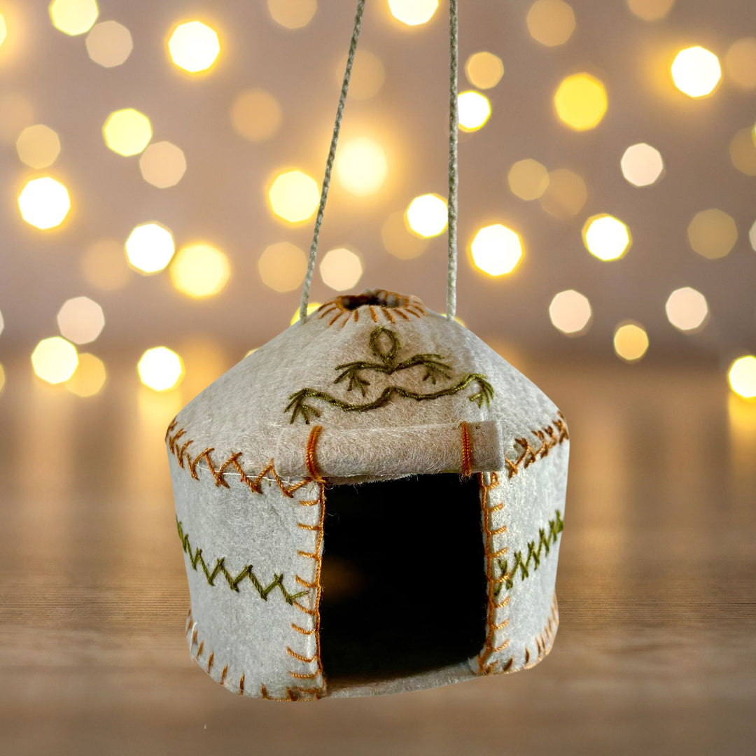 Grey Yurt Felt Ornament Christmas lights background