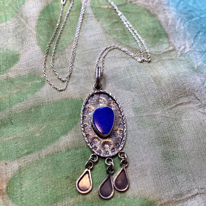 Nigina Silver Necklace on Silk Background Tajikistan