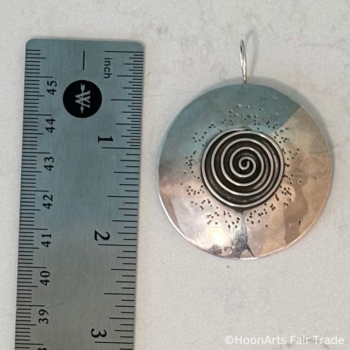 Bold disc earrings by Kyrgyz artisan Zhanyl Sharshembieva showing actual size