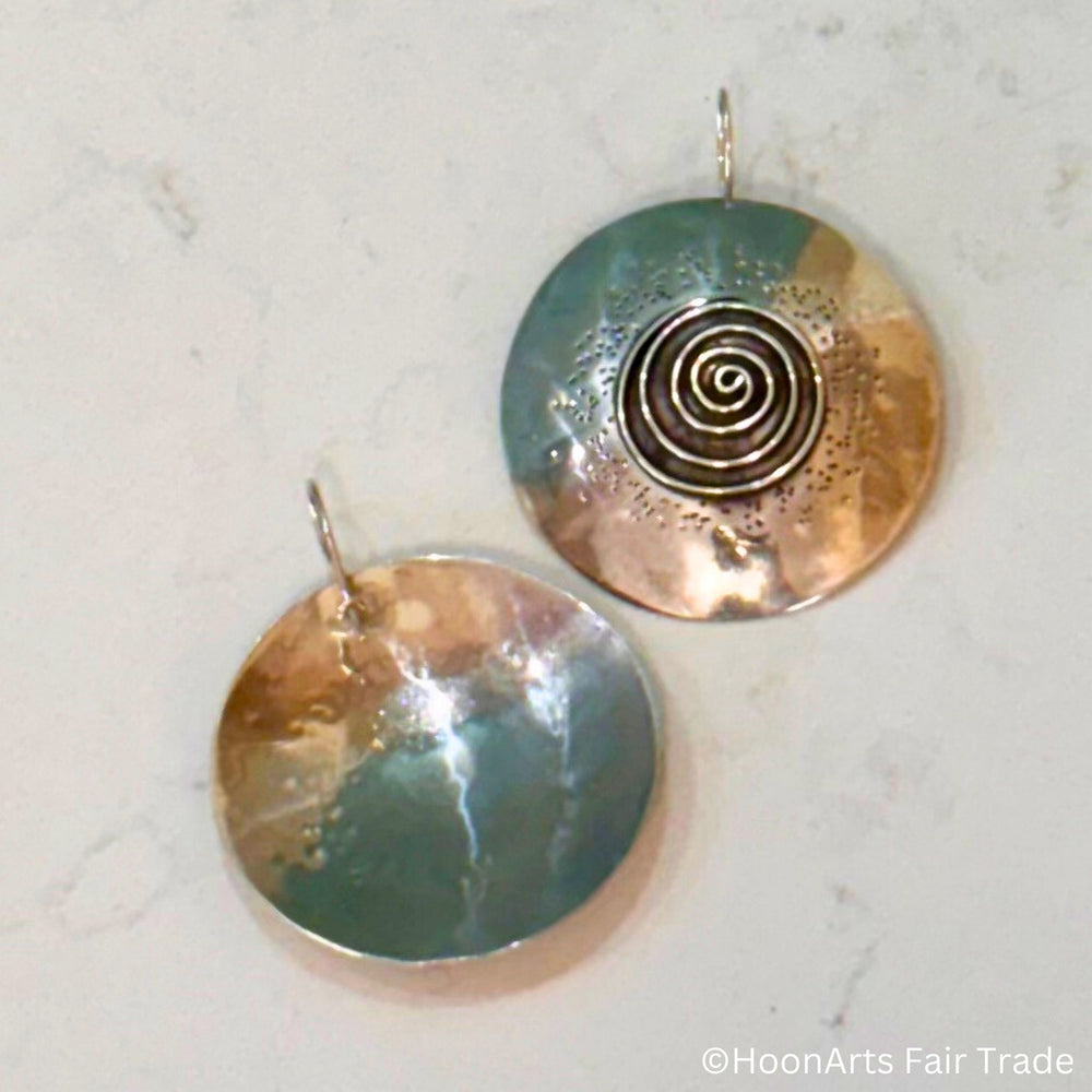 Unique spiral statement earrings from Seven Sisters artisan group showing front and back