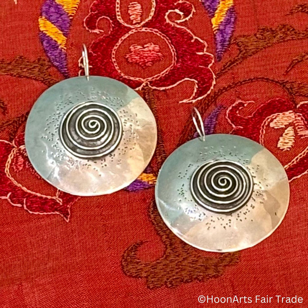 Sterling silver disc earrings with intricate spiral pattern