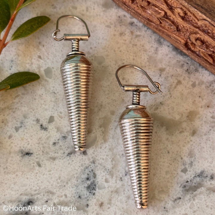 Close-up of intricate conical design on 'Saliha' silver earrings