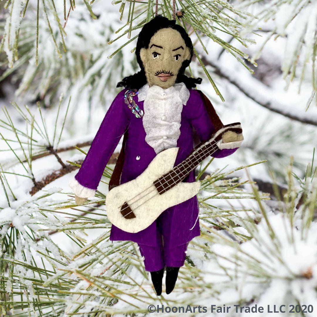 Handmade Christmas Ornament-Artist Formerly Known as Prince, dressed in purple with guitar, hanging from snow-covered pine tree 