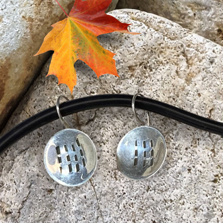 Earring on beach rock