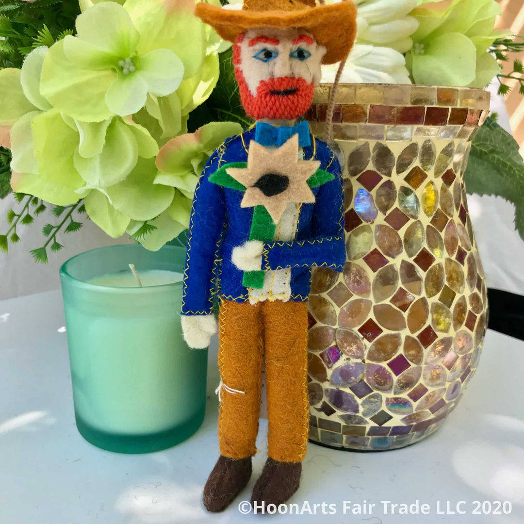 Felt Christmas Ornament-Vincent Van Gogh standing by a votive candle and a copper mosaic vase with yellow flowers