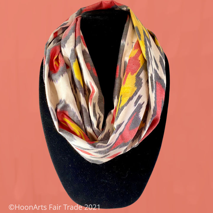 Red, white, yellow and grey handwoven silk and cotton ikat infinity scarf from Uzbekistan