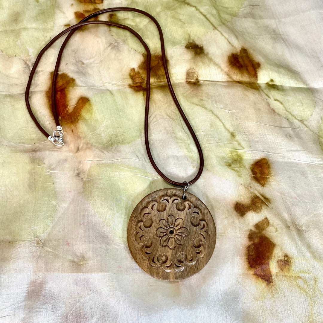 Round Wooden Pendant with Hand Carved Design 1