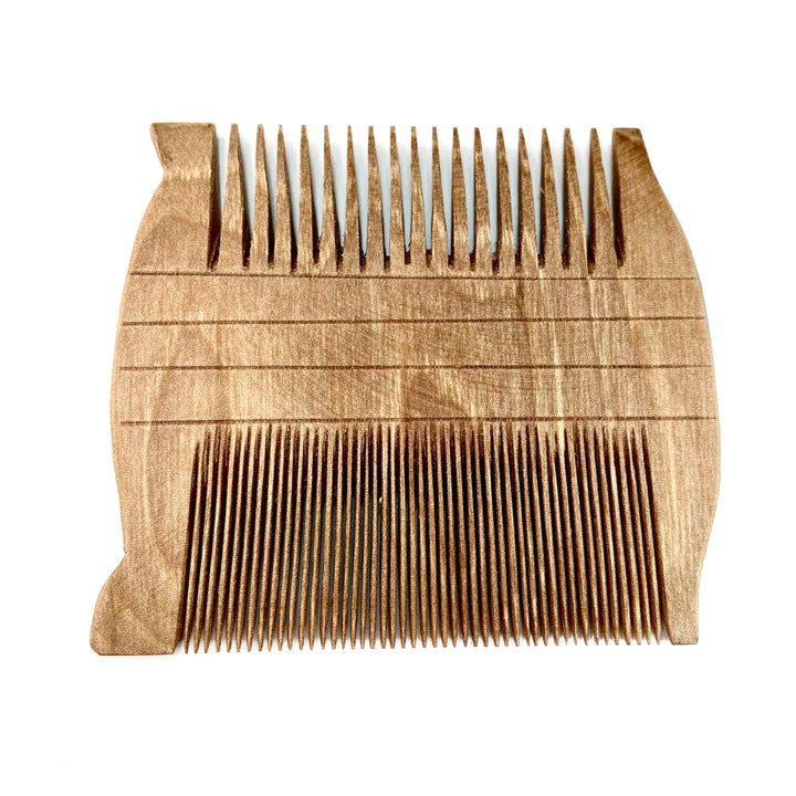 Small Hand-Craved Walnut Reproduction of Egyptian 2-Sided Comb on White Background
