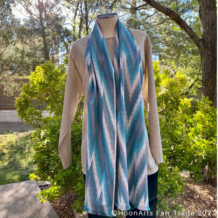 Turquoise & Grey Arrow Handwoven Ikat Scarf hanging on neck mannequin